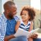 young-black-father-daughter-reading-600nw-1077765305